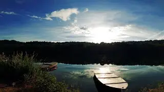 How Picturesque...Canoes Laze Around By The Lakeside