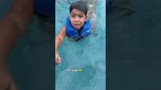 Son pushes mom in the pool after she tries to get him and dad out 