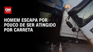 Homem escapa por pouco de ser atingido por carreta