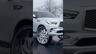 Infiniti QX on 34’s In the Rain