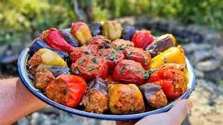 Tolma (dolma) in tomato juice in a cauldron over the fire!