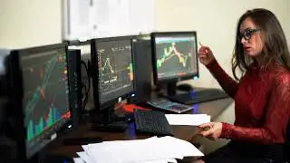 financial trader female on the background of monitors woman working with world stoc SBV 326163345 HD