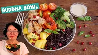 Buddha Bowl with Grilled Chicken + Black Rice. Healthy food with broccoli, mango, tomatoes...