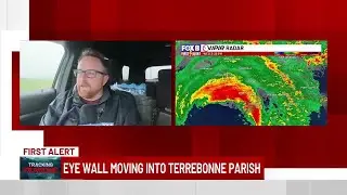 Rob Krieger braces as the eye wall moves into Terrebonne Parish