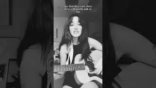 putting a melody to a poem i wrote last night. ignore my hair in my guitar!