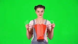 Girl Takes Out Package Then Looks Into It and Is Very Upset on a Green Screen | Stock Footage - ...