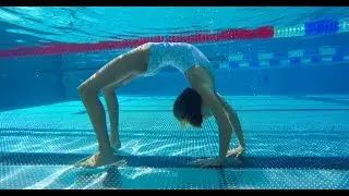 Carla underwater doing underwater gymnastics