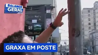 Dono de bar coloca graxa em um poste próximo para impedir invasões