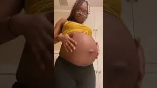 Preggo black lady huge belly