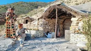 Zari and Shiva travel to the mountains to collect firewood and smooth the wall to build a bath