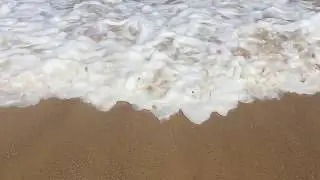 FREE STOCK FOOTAGE HD! Slow motion gentle waves on sandy beach.