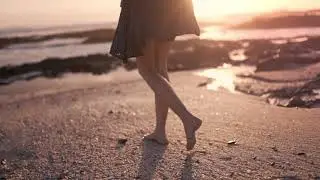 Woman Walking Barefooted On The Shore Full HD