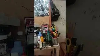 Streetside barber. Kumasi Ghana