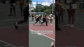 A police officer makes a layup during a game of basketball in a nearby park, the kids cheer him on.
