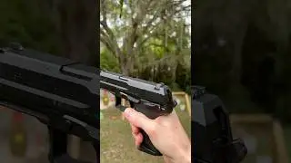 How do you decock a USP Compact pistol? [drop hammer without firing]