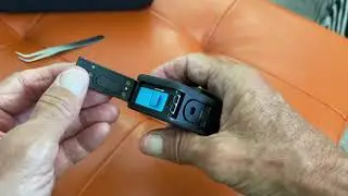 How to open the battery compartment door on GoPro Hero 10 Black