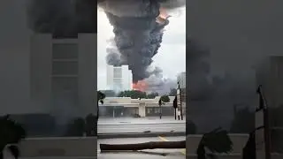 In front of a large Tornado on a Coastal Town  