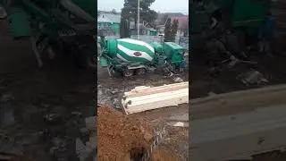 Concrete mixer sinks into mud
