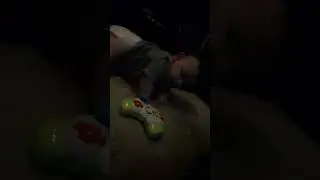 Enoch playing on the bed