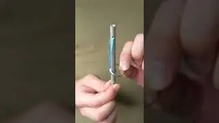 IQ test, how to remove the ring without cutting the rope?