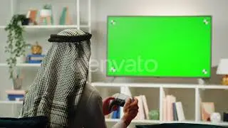 Middle Eastern Man Playing Video Game Tv with Chroma Key / Videohive, Stock footage, Religious