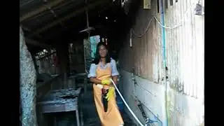 595 woman butcher in rubber apron  after slaughter cattle