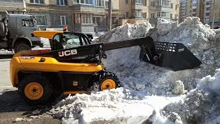 Loading of spring snow by JCB loader